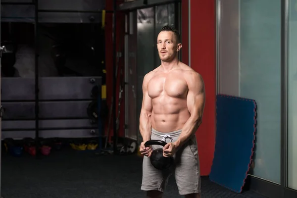 Young Man Exercising With Kettle Bell — Stock Photo, Image