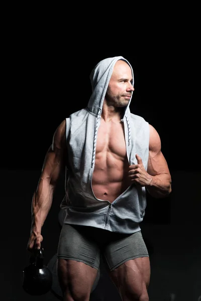 Muscular hombre ejercicio con hervidor de agua-campana —  Fotos de Stock