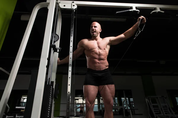 Bodybuilder Doing Heavy Exercise For Shoulders With Cable — Stock Photo, Image