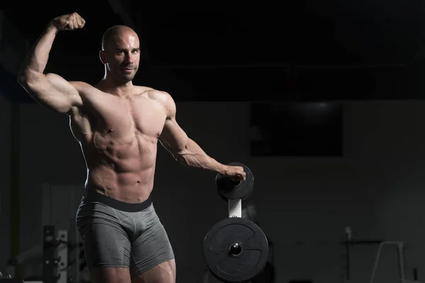 Bodybuilder Posing Double Biceps After Exercises — Stock Photo, Image