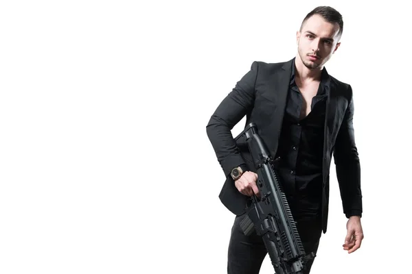 Бизнесмен с винтовкой на белом фоне — стоковое фото