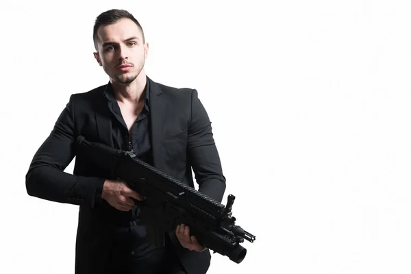 Бизнесмен с пистолетом изолирован на белом фоне — стоковое фото