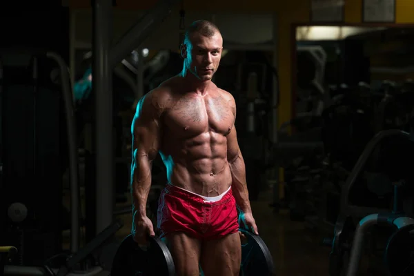 Bodybuilder Holding Weights In Hand — Stock Photo, Image