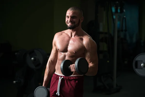Hombre Ejercitando Bíceps Gimnasio Dumbbell Concentration Curls —  Fotos de Stock