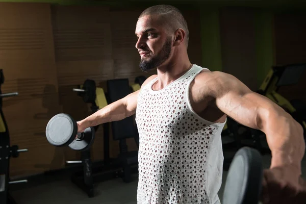 Idrottsman Tränar Axlar Ett Gym Dumbbell Koncentration Curls — Stockfoto