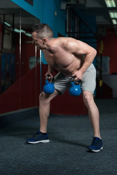 Young Man Exercising Kettle Bell Flexing Muscles Muscular Athletic Bodybuilder — Stock Photo, Image