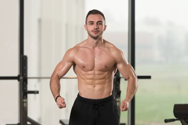 Handsome Young Man Standing Strong Gym Flexing Muscles Muscular Athletic — Stock Photo, Image