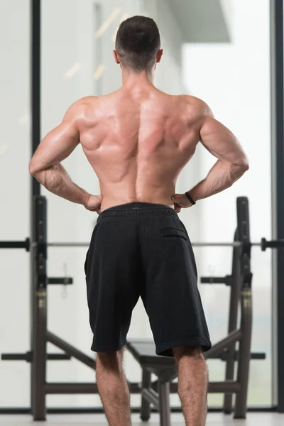 Handsome Young Man Standing Strong Gym Flexing Muscles Muscular Athletic — Stock Photo, Image