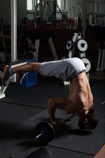 Athlete Exercising Push-Ups On Barbell In Elevation Mask — Stock Photo, Image