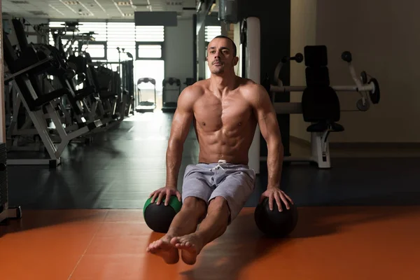 Man Exercising Handstand Push-Ups On Ball In Gym — Stock Photo, Image