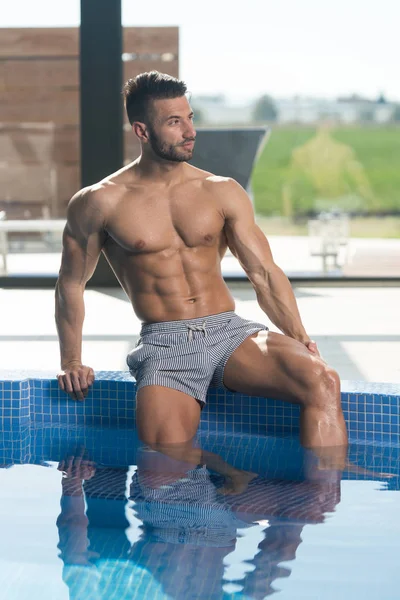 Young Looking Macho Man At Hotel Indoor Pool — Stock Photo, Image