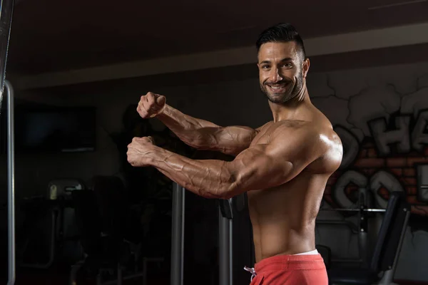 Handsome Man Flexing Muscles — Stock Photo, Image