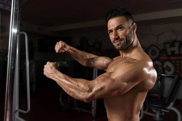 Handsome Man Flexing Muscles — Stock Photo, Image