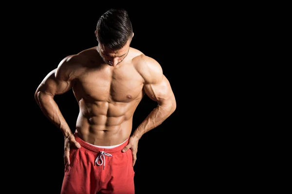 Muscular Men Flexing Muscles On Black Background — Stock Photo, Image