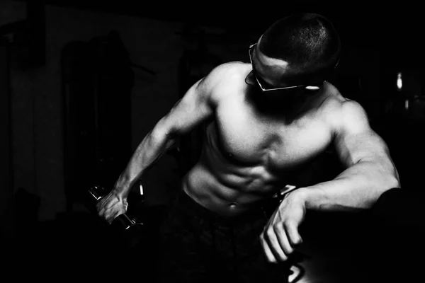 Geek Man With Dumbbell Exercising Triceps — Stock Photo, Image