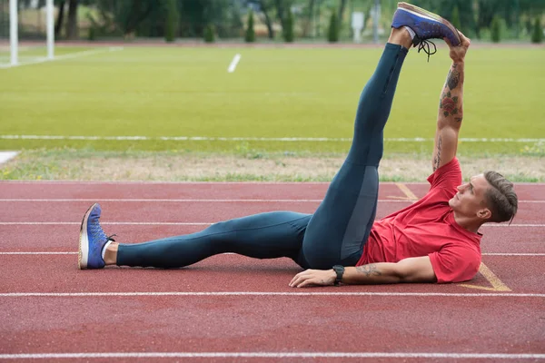 Young Athletic Man Stretching Before Running Exercise — Stock Photo, Image