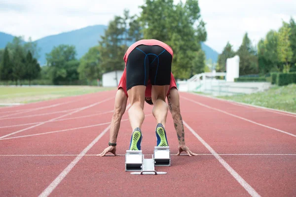 Sprinter Leaving Starting Blocks on the Running Track — Stock Photo, Image