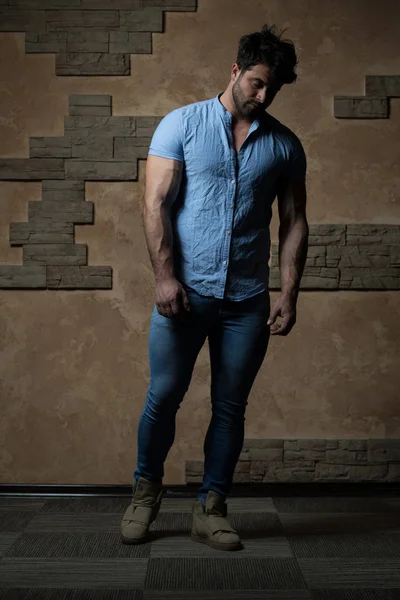 Man in Jeans Shirt Standing on Brick Background — Stock Photo, Image