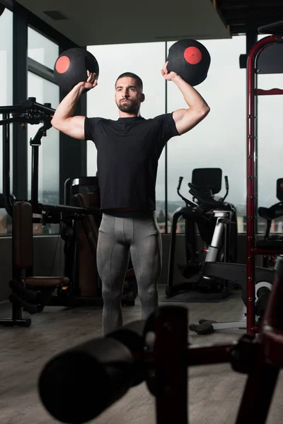 Man With Medicine Balls Exercising Shoulders — Stock Photo, Image