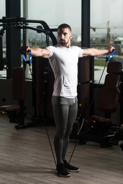 Athlete Exercising Shoulders With Pull Rope Elastic Cable