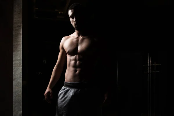 Portrait Of Fit Man In Dark Room — Stock Photo, Image