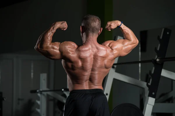 Mature Bodybuilder Posing Biceps After Exercises — Stock Photo, Image