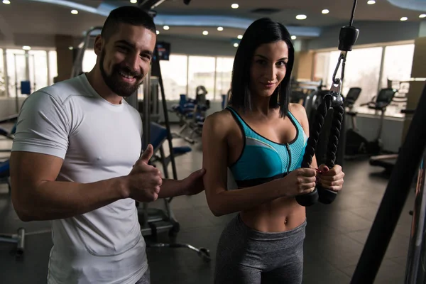 Woman Exercising Triceps With Her Personal Trainer — Stock Photo, Image