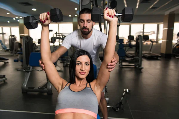 Couple With Dumbbells Exercising Back In Gym — Stock Photo, Image
