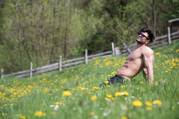 Portrait of Man Lying Down Outdoors in Nature — Stock Photo, Image