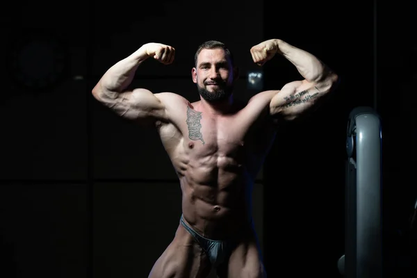 Muscular Men Is Hitting Rear Double Bicep Pose — Stock Photo, Image