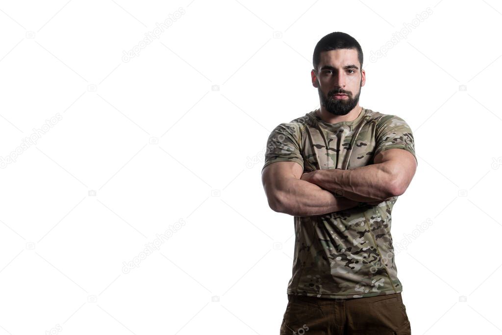 Portrait of Young Soldier Arms Crossed on a White Background