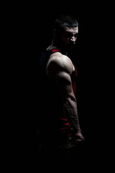 Jeune Bodybuilder Flexion Des Muscles Isoler Sur Blackground Noir Espace — Photo
