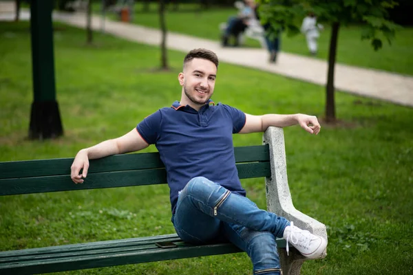 Portrait Confident Successful Young Man Blue Shirt Park Sitting Bench — Stock Photo, Image