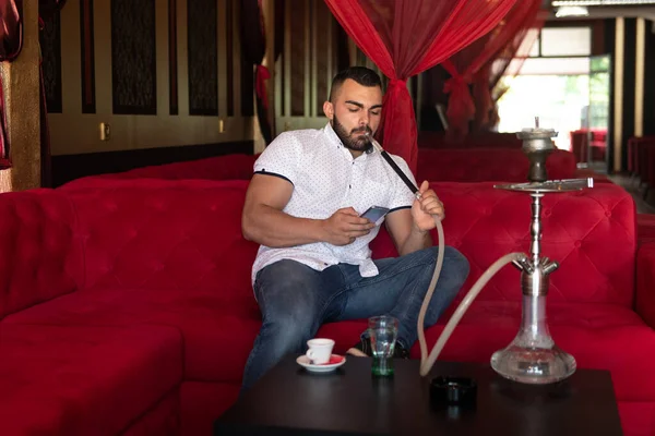 Young Man Smoking Shisha Arabic Restaurant Man Exhaling Smoke Inhaling — Stock Photo, Image