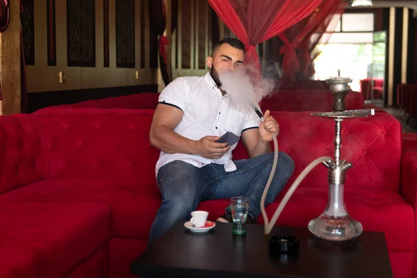 Young Man Smoking Shisha Arabic Restaurant Man Exhaling Smoke Inhaling — Stock Photo, Image