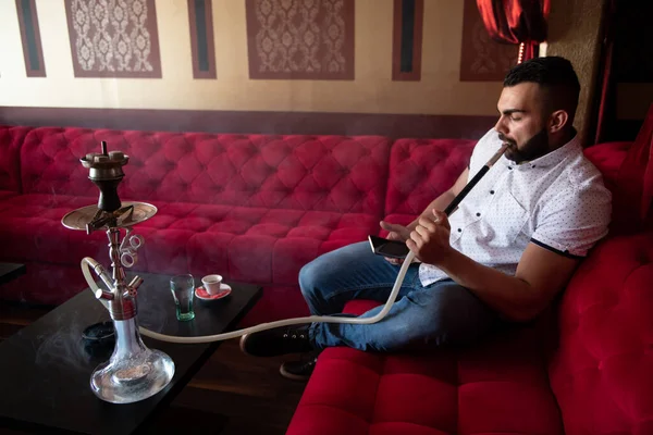 Young Man Smoking Shisha Arabic Restaurant Man Exhaling Smoke Inhaling — Stock Photo, Image