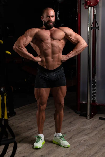 Handsome Young Man Standing Strong Gym Flexing Muscles Muscular Athletic — Stock Photo, Image