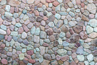 Taş duvarın dokusu. Tasarım deseni dekoratif gerçek taş duvar yüzeyi çimentoyla. Kaya duvarının doğal arka planı.