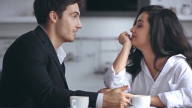 businessman smiling and talking with girlfriend 