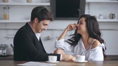 businessman smiling and talking with girlfriend 