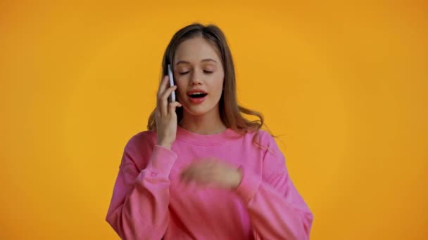 Teenager Talking Smartphone Isolated Yellow — Stock Video