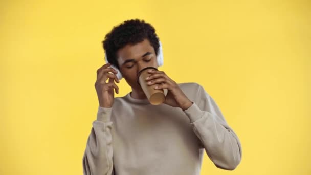 African American Teenager Drinking Coffee Isolated Yellow — Stock Video