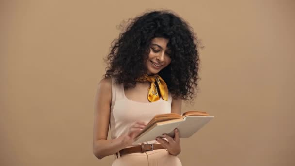Smiling Racial Woman Reading Book Isolated Beige — 비디오