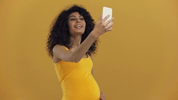 Smiling Racial Pregnant Woman Having Video Chat Isolated Dark Yellow — 비디오