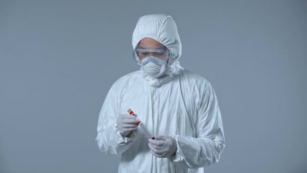 Asian Scientist Holding Test Tube Isolated Grey — 비디오