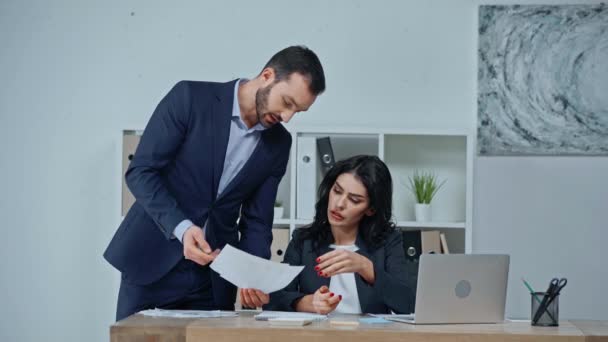 Businessman Showing Documents Businesswoman Sitting Laptop — Stock Video