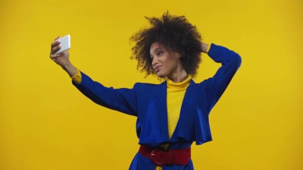 African American Woman Taking Selfie Isolated Yellow — Stock Video
