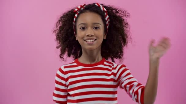 Cute African American Child Waving Hands Isolated Pink — Stok video