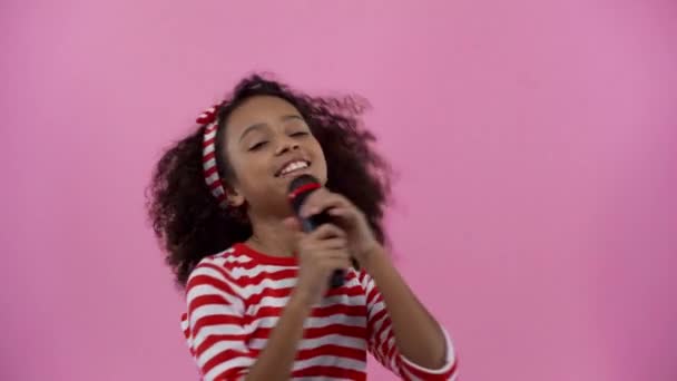 Happy African American Kid Singing Isolated Pink — ストック動画