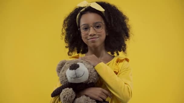 African American Kid Holding Soft Toy Isolated Yellow — Stock Video